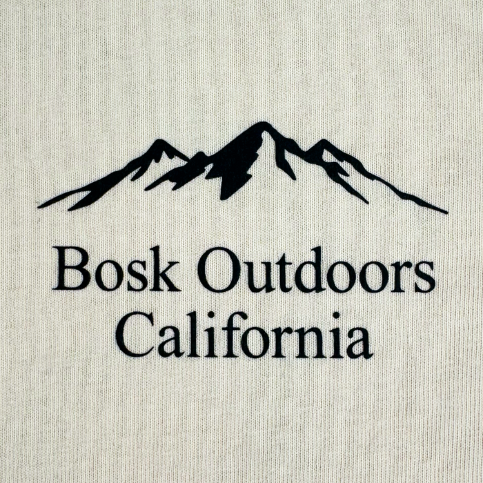 Featuring a black outline of a mountain range above the words โBosk Outdoors California,โ the Other Bosk Outdoors Tee is printed on a light-colored, heavyweight cotton fabric. The bold, clear lettering and centered design add to its modern look. Designed in an oversized fit and available in menโs sizing, this t-shirt ensures comfort for every outdoor adventure.