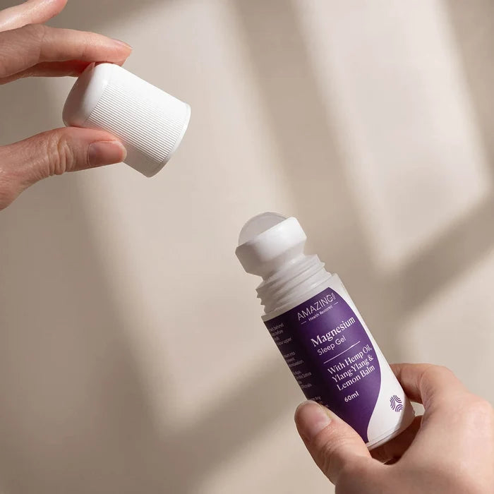 Person holding Magnesium Sleep Gel with lid open. Magnesium gel with hemp oil, ylang-ylang & lemon balm.