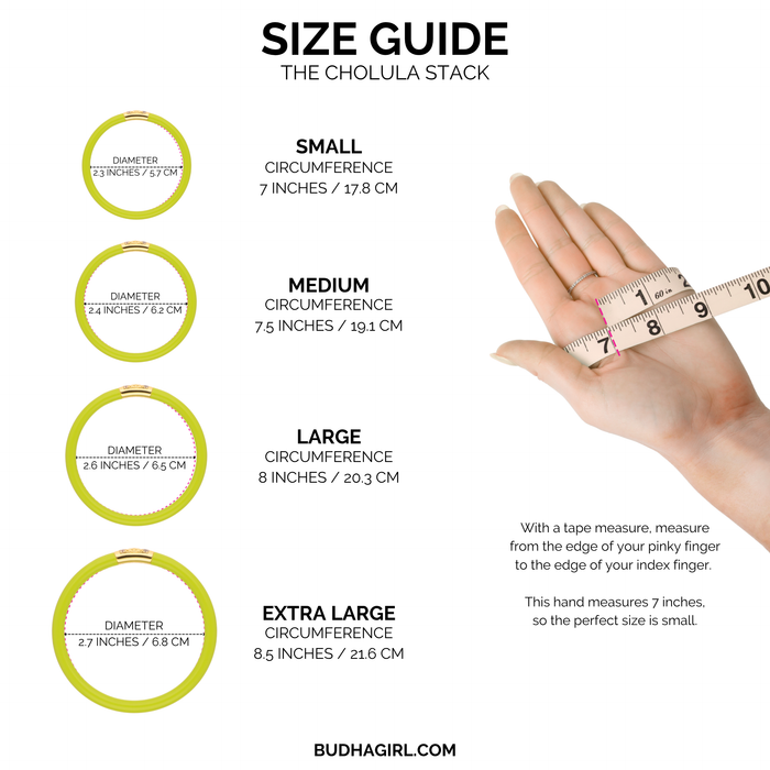 a hand holding a measuring tape