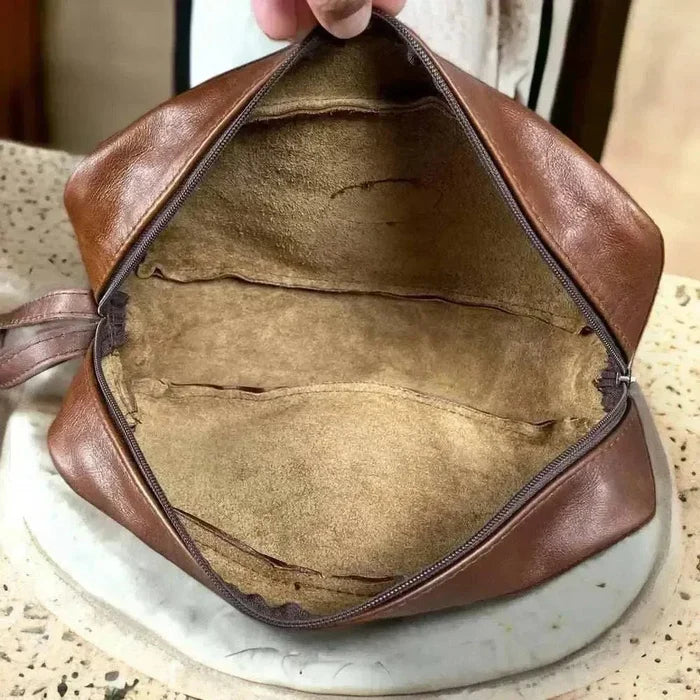Light brown genuine leather shaving bag by Woesmooi with compact design