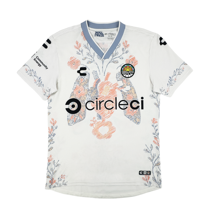 The 2026 OAKLAND SOUL SC FORM JERSEY by Oakland Soul features white high-quality polyester, pastel blue trim, and a pink-blue floral pattern. Two large koi fish and orange flowers decorate the front, with "circleci" logos on chest, sleeves, and collar.