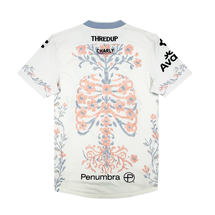 The 2026 OAKLAND SOUL SC FORM JERSEY by Oakland Soul is a white short-sleeve polyester top with blue and orange ribcage and spine details, botanical patterns, and “THREDUP” plus “Penumbra” logos on the back and sleeves.