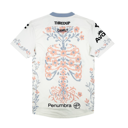 The 2026 OAKLAND SOUL SC FORM JERSEY by Oakland Soul is a white short-sleeve polyester top with blue and orange ribcage and spine details, botanical patterns, and “THREDUP” plus “Penumbra” logos on the back and sleeves.