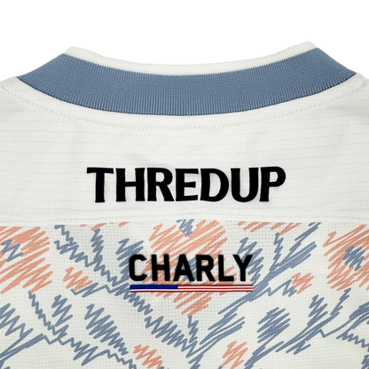 Close-up of the upper back of a white Oakland Soul 2026 SC Form Jersey, crafted from high-quality polyester. "THREDUP" is in bold black above "OAKLAND SOUL," with a red, white, and blue stripe and abstract orange and blue accents.