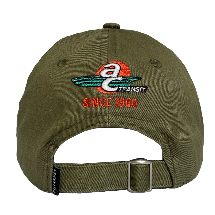 The Oaklandish AC Transit Dad Hat features a vintage-inspired green design with an embroidered "a TRANSIT SINCE 1960" logo, paying homage to classic AC Transit style.
