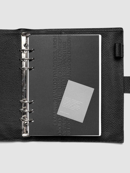Black embossed Analog Embossed Planner Dashboard with drop card shown in size A5 6-Ring Punch.