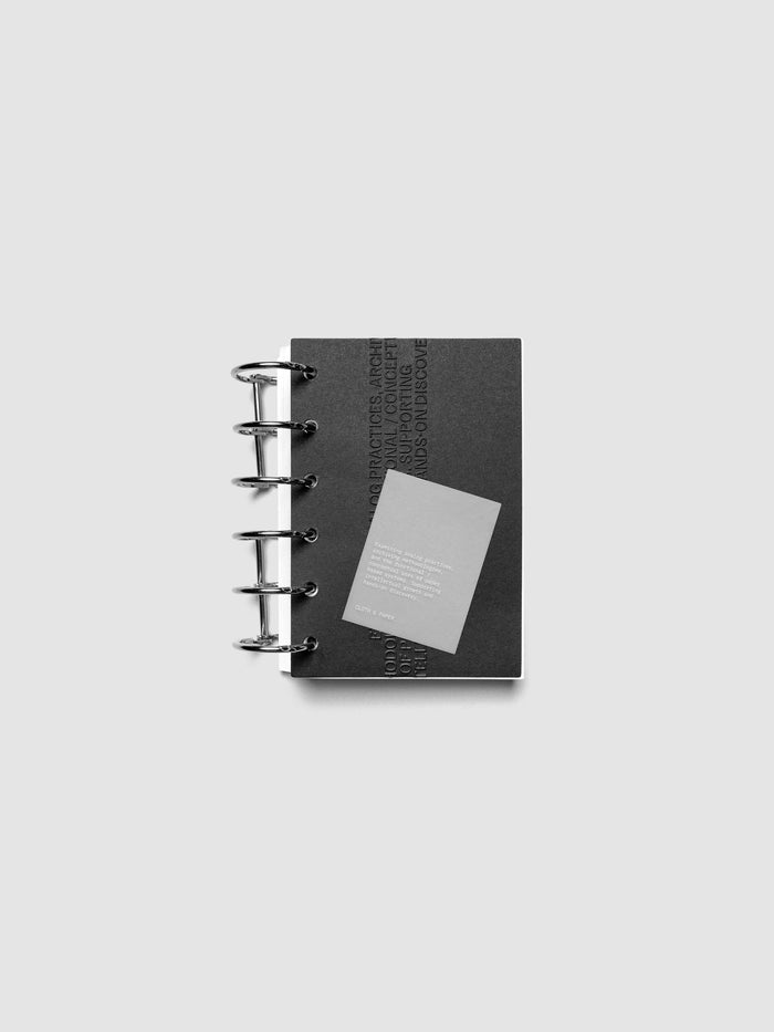 Black embossed Analog Embossed Planner Dashboard with drop card shown in size Pocket.
