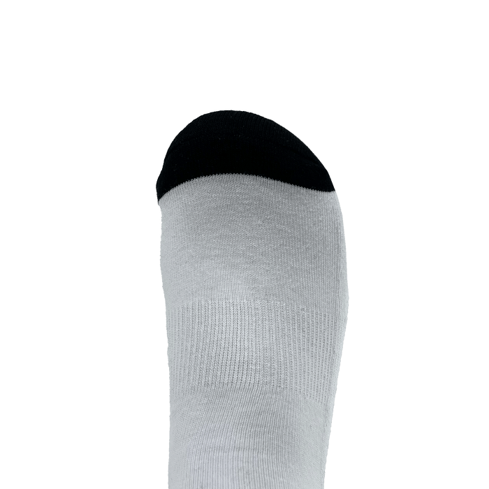 Close-up of black toe bed on white Oaklandish crew sock.