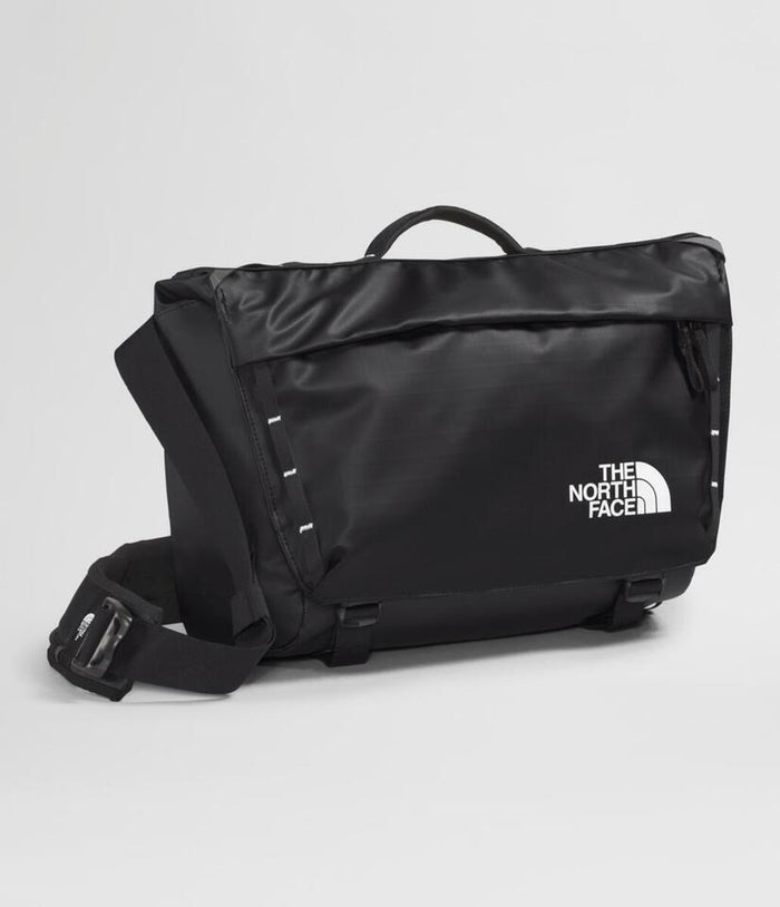 Black The North Face bag on a light gray background