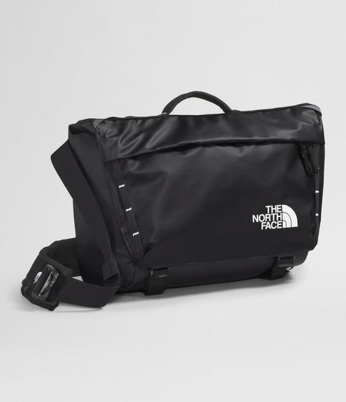 Black The North Face bag on a light gray background