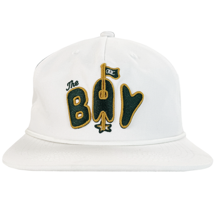 The Bay Area 5 Panel by DOC from Oaklandish is a white unstructured strap back hat with green and gold “The Bay” embroidery, featuring a gold bat-shaped "A," green flag, and gold star. Part of The Bay Collection.