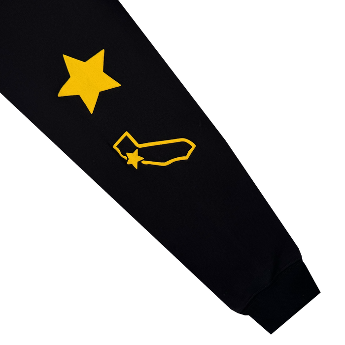 The Bay Bridge Hoodie By DOC V2 from Oaklandish features a bold yellow star atop a California outline on black sleeves, with an extra star near the wrist. Crisp white background makes it perfect to pair with your favorite pullover or men's fleece hoodie.