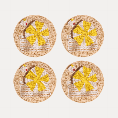 a group of coasters with a beach scene