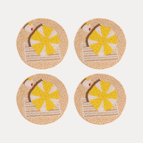 a group of coasters with a beach scene