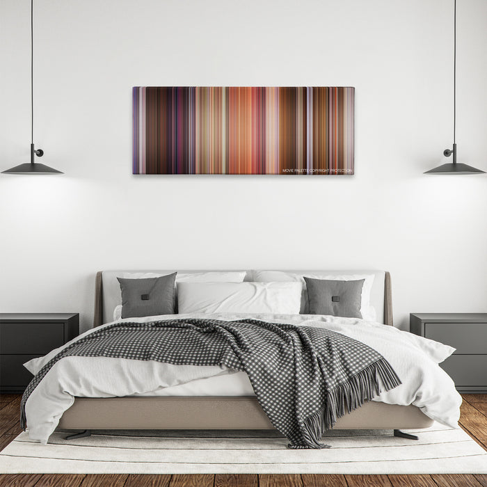 Bedazzled color palette canvas above a bed, between two black pendant lamps