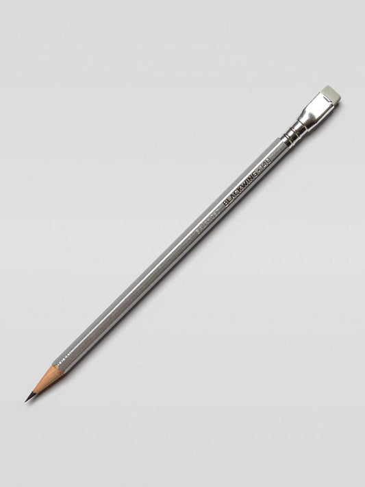 Single Blackwing 140 pencil placed diagonally on a light background, emphasizing the sleek, stainless steel-inspired barrel.