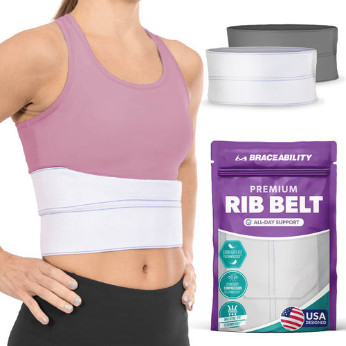The BraceAbility broken rib brace is a white, wrap-around, compression belt to help immobilize fractured, cracked, or dislocated ribs and provide pain support