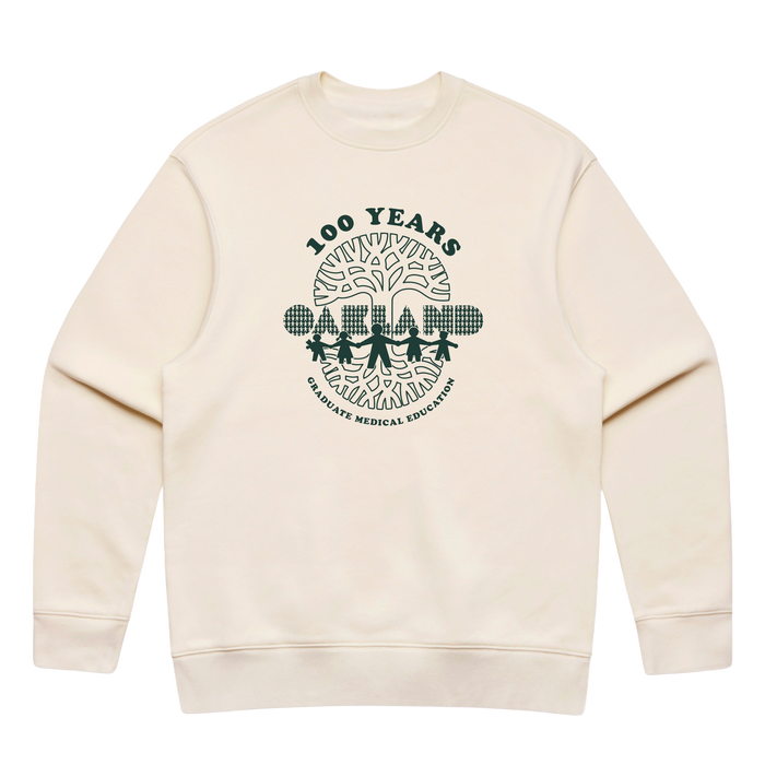 The Oaklandish Century of Caring Crew is a cream-colored sweatshirt featuring a dark green “100 YEARS” logo. Its design showcases four figures holding hands beneath a tree adorned with medical symbols, with “GRADUATE MEDICAL EDUCATION” encircling the illustration. Inspired by the Oaklandish Centennial tee, this piece honors UCSF Benioff Children’s Hospital Oakland and its enduring legacy in Graduate Medical Education.