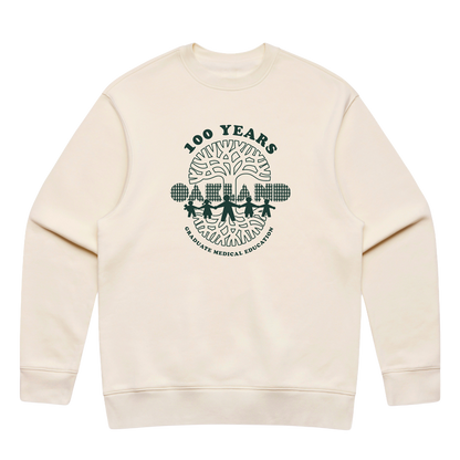 The Oaklandish Century of Caring Crew is a cream-colored sweatshirt featuring a dark green “100 YEARS” logo. Its design showcases four figures holding hands beneath a tree adorned with medical symbols, with “GRADUATE MEDICAL EDUCATION” encircling the illustration. Inspired by the Oaklandish Centennial tee, this piece honors UCSF Benioff Children’s Hospital Oakland and its enduring legacy in Graduate Medical Education.