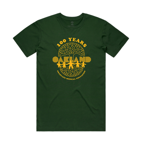 Introducing the Oaklandish Century of Caring Tee: a dark green shirt featuring a bold yellow print that reads "100 YEARS GRADUATE MEDICAL EDUCATION" above trees and a city skyline, with "OAKLAND" prominently displayed in block letters in front of the trees. This special edition tee celebrates UCSF Benioff Children’s Hospital Oakland’s century-long commitment to Graduate Medical Education.