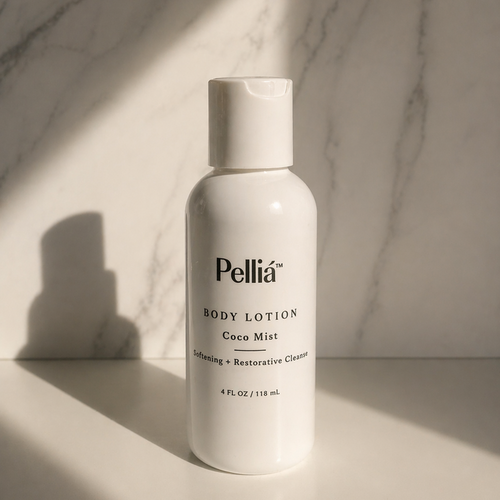 Pellia body lotion mini travel bottle on a marble surface with soft lighting