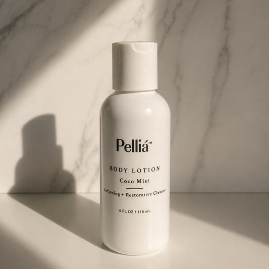 Pellia body lotion mini travel bottle on a marble surface with soft lighting