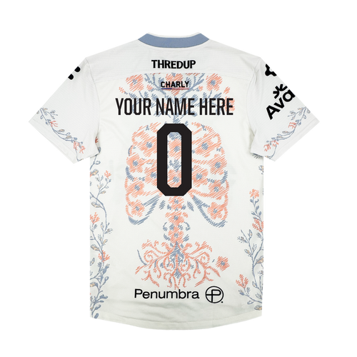 A white Oakland Soul Custom 2026 SC Form Jersey, seen from the back, has blue and orange lung graphics, black sponsor logos, "YOUR NAME HERE" and a bold number 0. The light blue collar and sleeves feature delicate branch accents.