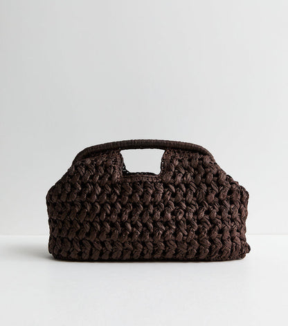 Dark brown woven raffia clutch handbag with slouchy design from Grace Beauty, stylish and perfect for casual or evening wear.
