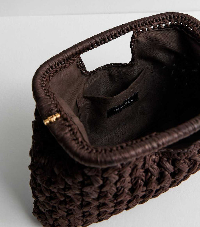 Dark brown woven raffia clutch handbag with slouchy design by Grace Beauty, featuring a casual, textured appearance.