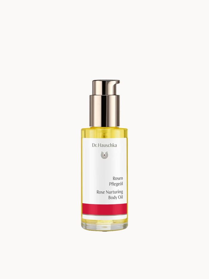 Dr. Hauschka Rose Nurturing Body Oil bottle with rose floral design, 75ml for sensitive skin, displayed in natural setting