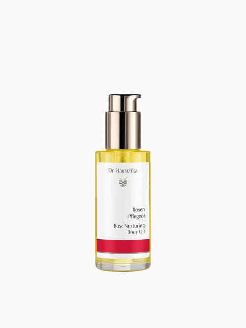 Dr. Hauschka Rose Nurturing Body Oil bottle with rose floral design, 75ml for sensitive skin, displayed in natural setting