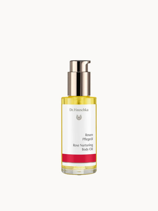 Dr. Hauschka Rose Nurturing Body Oil bottle with rose floral design, 75ml for sensitive skin, displayed in natural setting