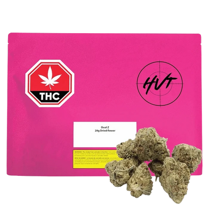Front-facing shot of a bright pink pouch labeled Dual Z with a THC octagon graphic and several cannabis buds arranged at the lower right.