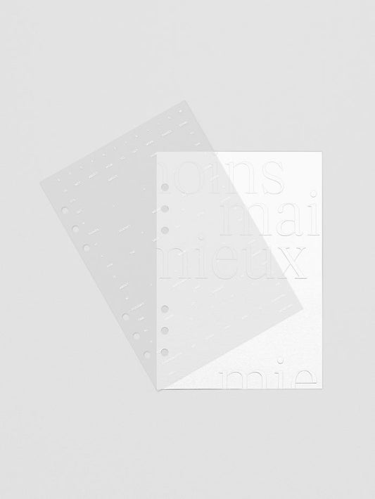 Essentialism Dashboard Duo reading "moins mai mieux" in size A5 shown offset to display a transparent and cardstock layer.