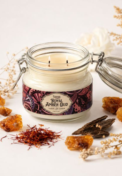 Royal Amber Oud jar candle with cream wax, two wicks, and metal clasp lid; unlit
