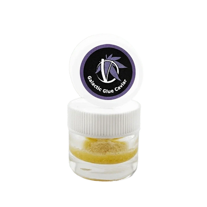 Centered front view of a small clear jar with white lid and purple logo reading Galactic Glue Caviar, showing a golden granular concentrate inside.
