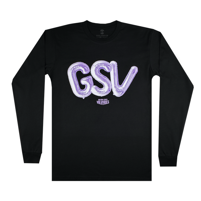 The Golden State Valkyries Balloons LS Tee by GSV is a black cotton long-sleeve featuring large, shiny purple “GSV” balloon letters on the chest and small white “Guilty Simpson & Vally Vanes” text below, shown flat on a white background.