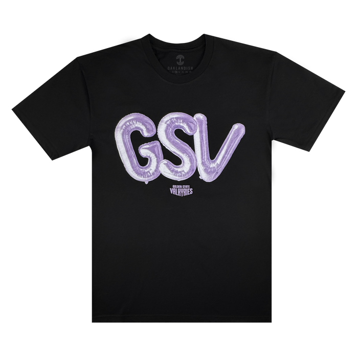 The Golden State Valkyries Balloons Tee by GSV is a black cotton shirt with large, shiny purple balloon-style "GSV" letters across the chest and "Golden State Valkyries" in small white text below, shown laid flat on a white background.