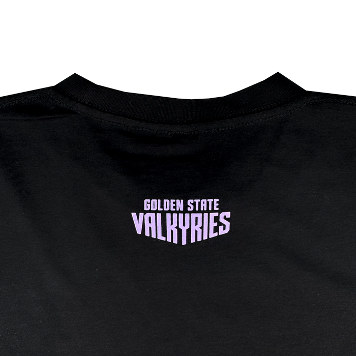 The image features the back of the GSV Golden State Valkyries Rec League Tee, an organic cotton shirt in black. Centered below the neckline, "GOLDEN STATE VALKYRIES" appears in bold pale purple blocky uppercase letters.
