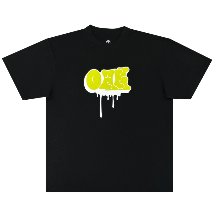 The Oaklandish Graff OAK Tee is a black, heavyweight 100% cotton t-shirt with a bold yellow graffiti-style “ONE” logo and white paint drips, shown laid flat on a plain white background for classic comfort and style.