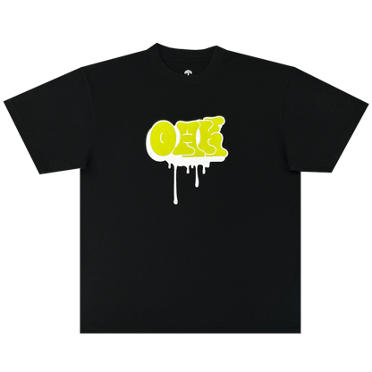 The Oaklandish Graff OAK Tee is a black, heavyweight 100% cotton t-shirt with a bold yellow graffiti-style “ONE” logo and white paint drips, shown laid flat on a plain white background for classic comfort and style.