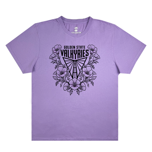 The GSV Poppies Tee by GSV is a lavender garment-dyed, 100% cotton t-shirt featuring black “Golden State Valkyries” text above a stylized Valkyrie helmet surrounded by illustrated poppy flowers and leaves. This short-sleeve shirt has no additional designs or patterns.