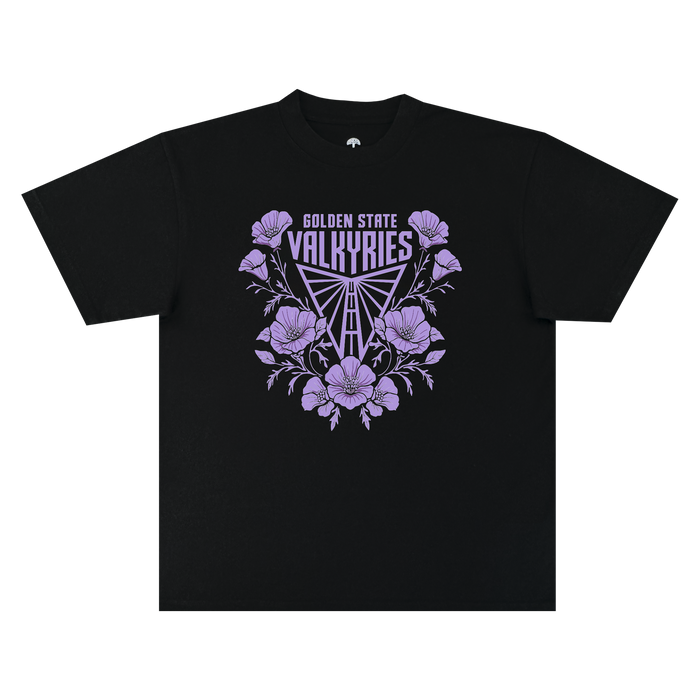 The GSV Poppies Tee by GSV is a classic fit t-shirt made from 100% cotton, showcasing “GOLDEN STATE VALKYRIES” above a triangular, stylized logo, all framed by lilac-hued flowers and leaves and centered on the chest.