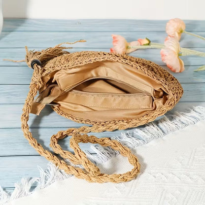 Handwoven fashion round hollow raffia shell crossbody shoulder bag by Grace Beauty, showing intricate woven design and shoulder strap.