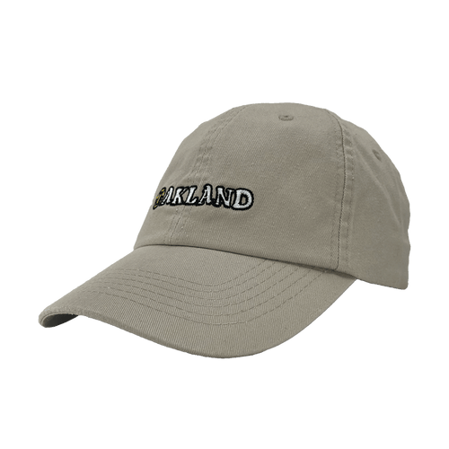 Angled side view of khaki Oakland Dad Hat, with embroidered design by Dustin O. Canalin (DOC).