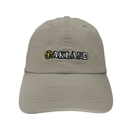 Front view of khaki Oakland Dad Hat, with embroidered wordmark design by Dustin O. Canalin (DOC).