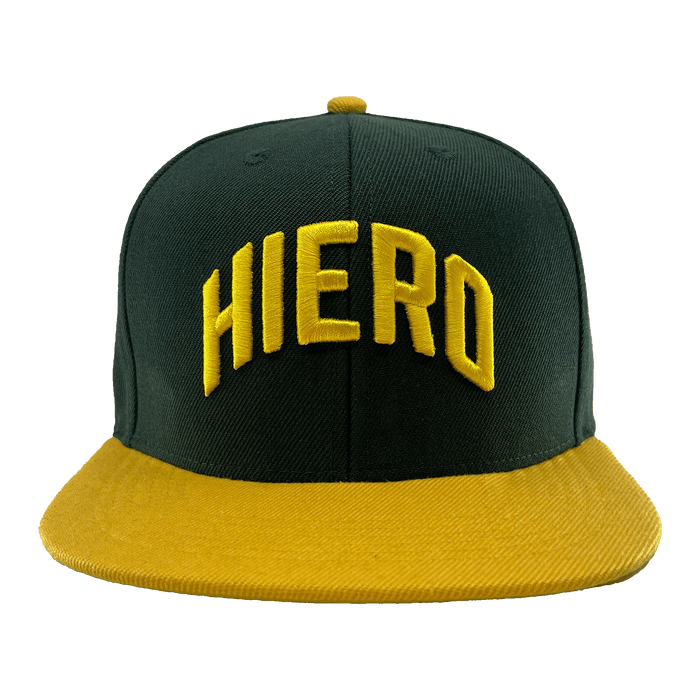 Front view green snapback cap with a yellow flat-billed visor and an embroidered HIERO wordmark on the crown.