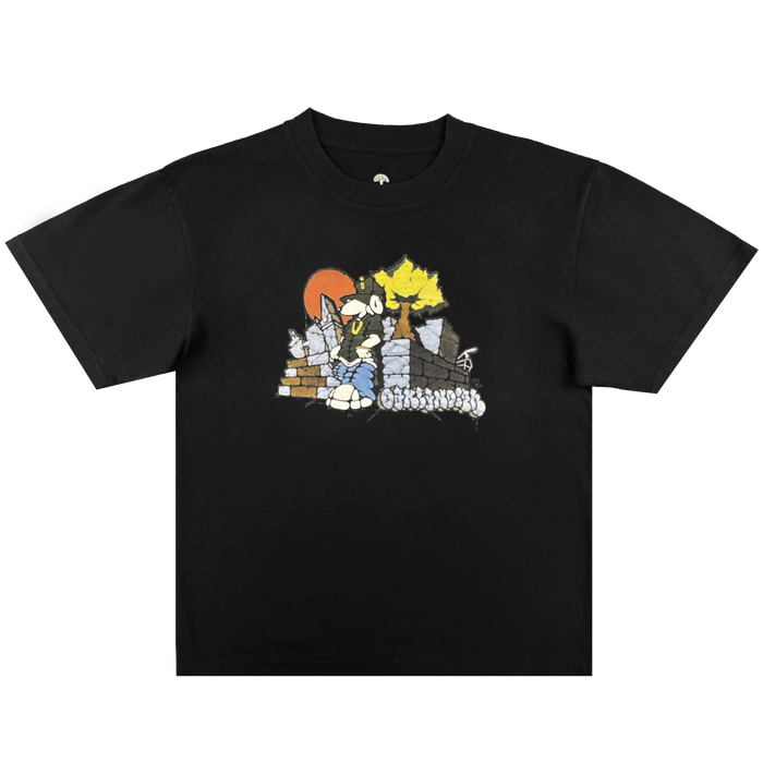 The Oaklandish Highroller Tee is a men's black t-shirt with a cartoon blue cat ninja, yellow hair, red sun, and brick wall on a stone path. Made from heavy-weight cotton, this classic fit tee offers lasting comfort and durability.