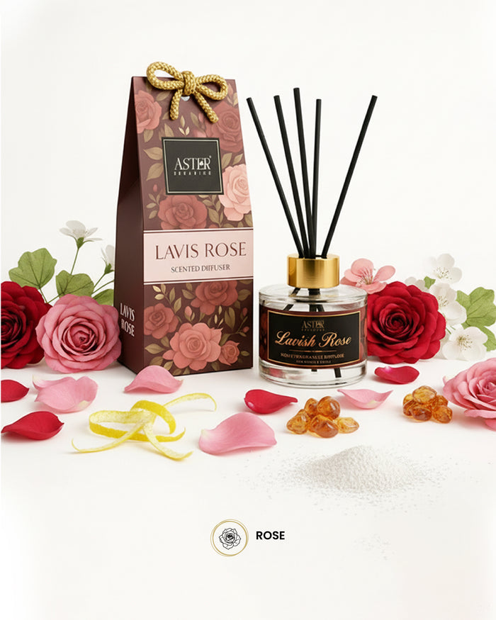 Lavish Rose reed diffuser set with rose petals and diffuser reeds in a glass bottle.