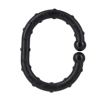 A black, oval-shaped ring with a textured surface and raised bumps, featuring two rounded ends that nearly meet. Made for sensory play, this is part of the Linkables Teething Toys - Black, Grey, & White - 18 pack.